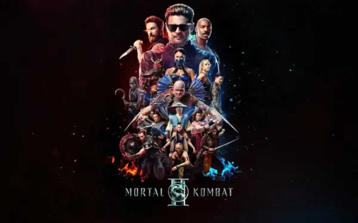 Pôster oficial do filme Mortal Kombat 2 em um fundo preto profundo. A composição central apresenta diversos personagens icônicos da franquia em poses de combate, com destaque para Johnny Cage no topo usando óculos escuros. Abaixo dele, guerreiros como Kitana, Shao Kahn e outros aparecem cercados por efeitos visuais de faíscas laranjas e chamas azuis. O título Mortal Kombat 2 aparece na parte inferior com o logotipo do dragão entre as palavras.